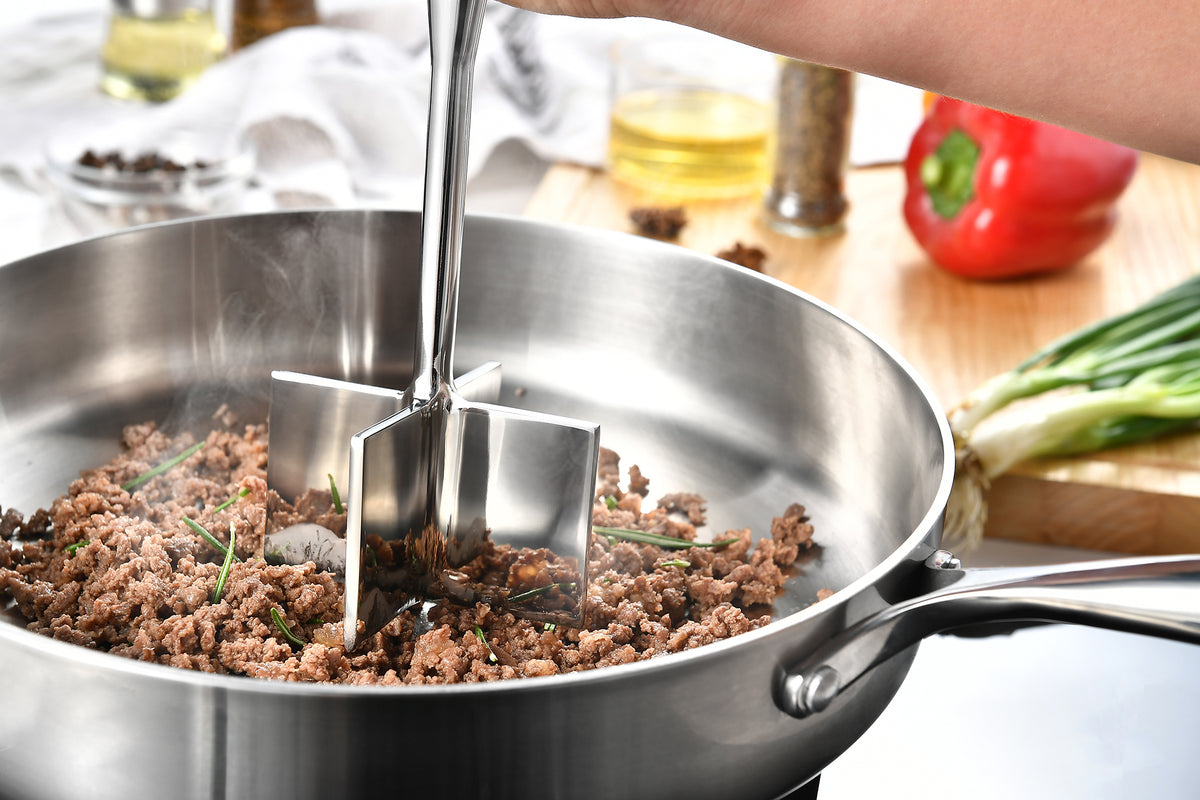 Gerior stainless steel meat chopper chopping in a pan of browned ground beef