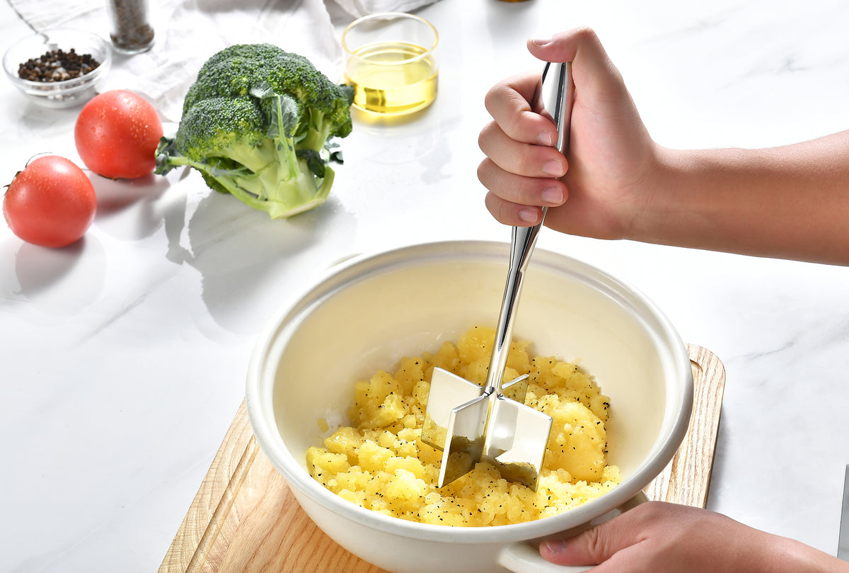 Gerior stainless steel meat chopper chopping in a bowl of potato